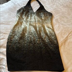 Elegant Black and Gold Halter Dress with lace on the bottom.
